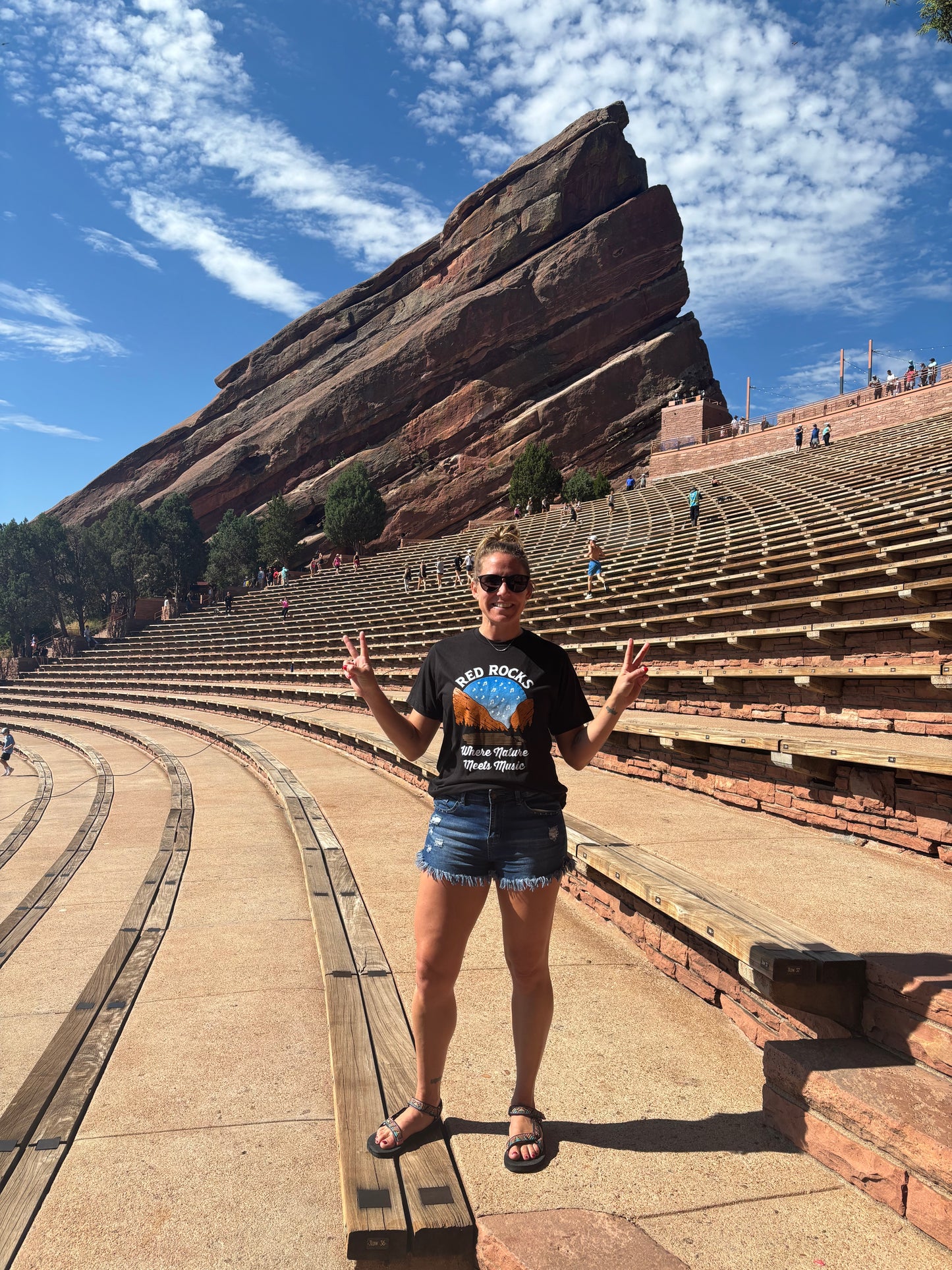 Girl wearing shirt in Red Rocks amphitheater