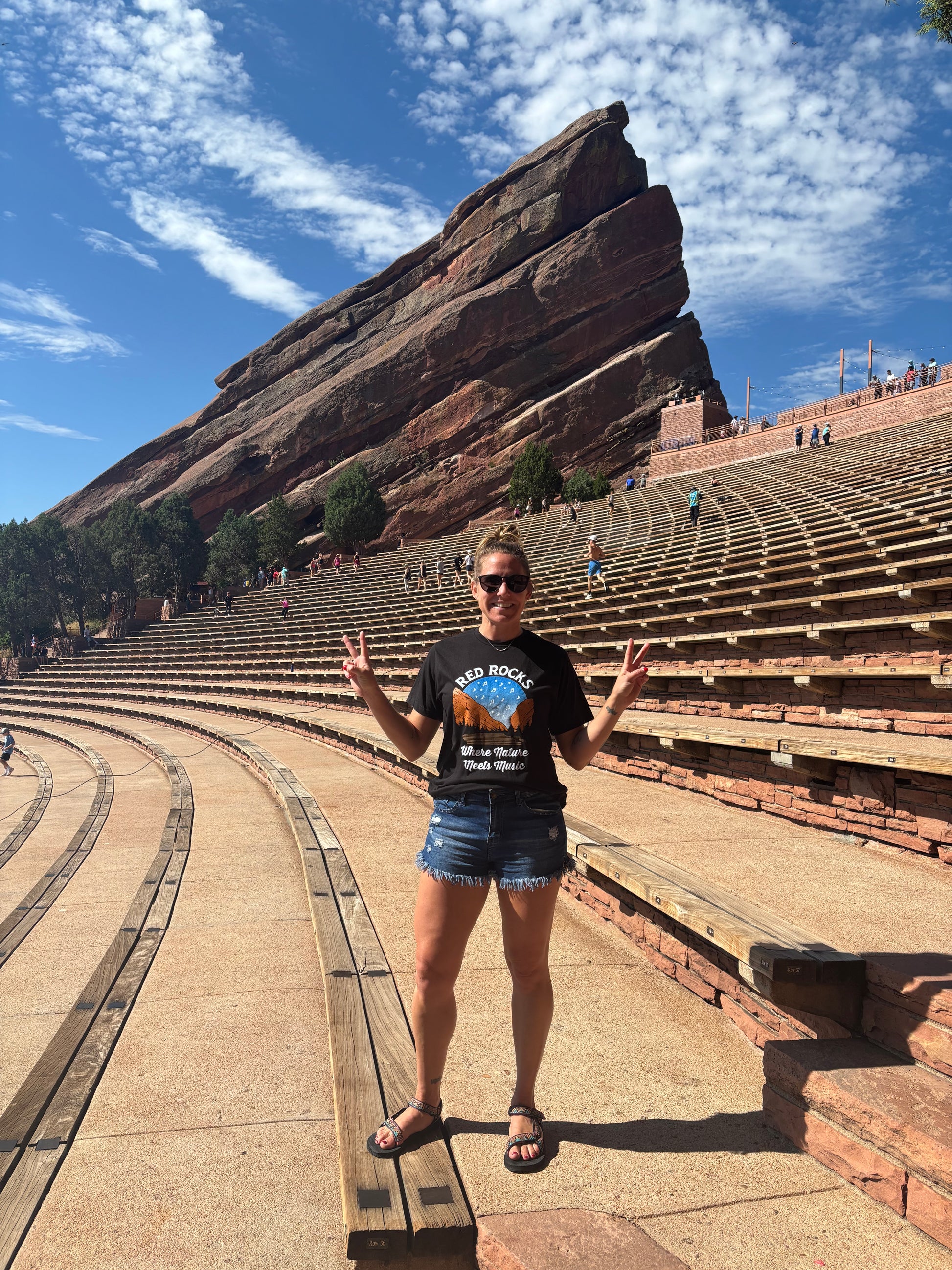 Girl wearing shirt in Red Rocks amphitheater